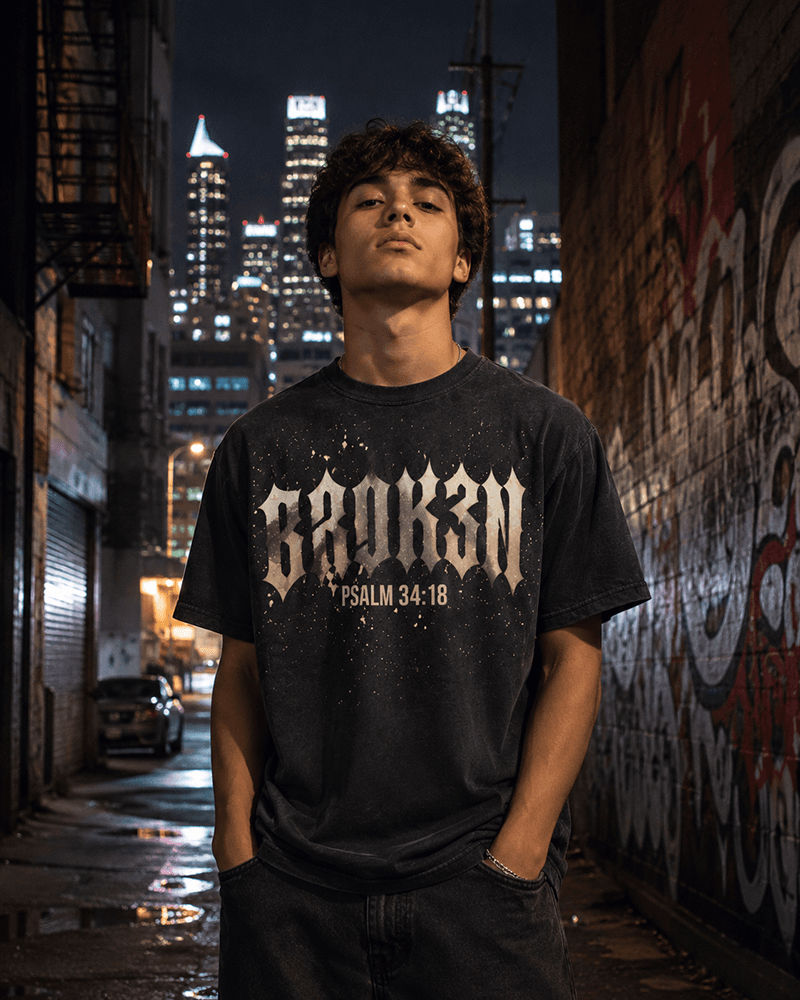 BROK3N tee worn in a city alleyway at night